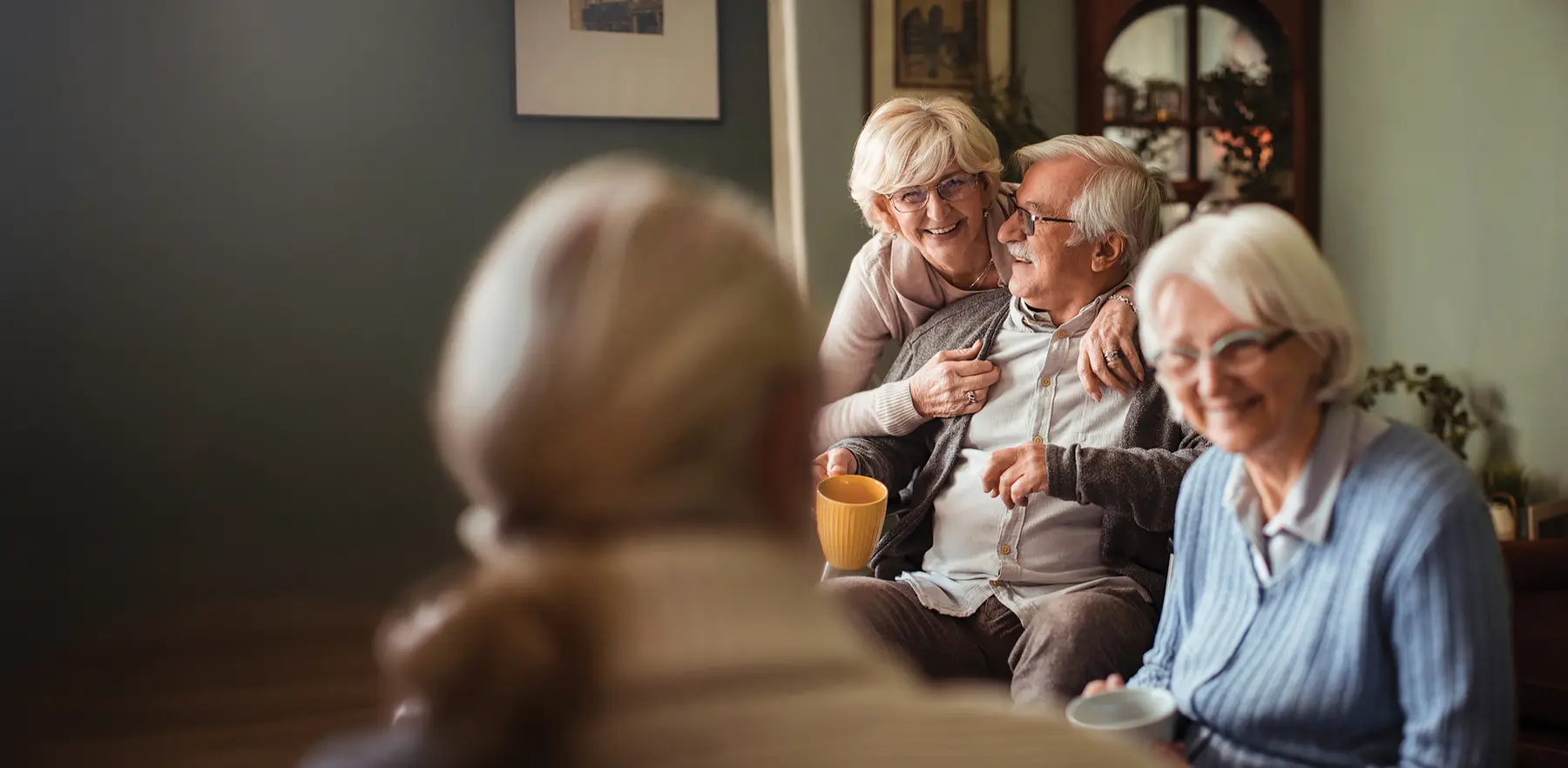 Residents sharing coffee and conversation at Cherish Adult Family Home